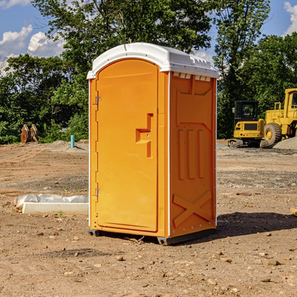 what is the cost difference between standard and deluxe portable restroom rentals in Heron Lake